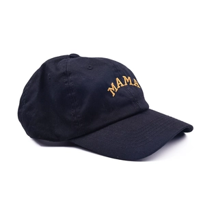 Detail of yellow MAMA embroidery on a black cotton baseball cap with a soft top