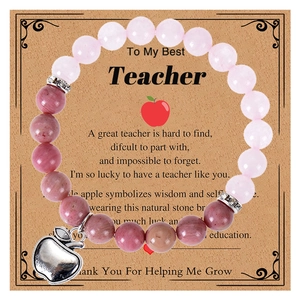 Detail of pink zebra stone beads and silver apple charm on a teacher gift card