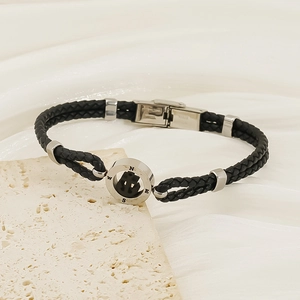 Men's minimalist black woven leather bracelet with silver stainless steel compass charm