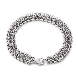 Three-layer stainless steel chain bracelet with silver pearl accents on white background