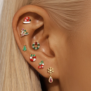 Detailed view of S925 silver Christmas earrings with festive rhinestone charms on ear
