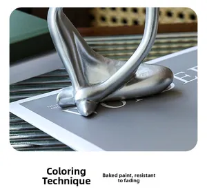 Detailed view of silver thinker sculpture base with smooth metallic finish and texture