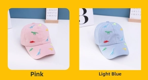 Close-up of pink and light blue cotton baseball caps with colorful dinosaur embroidery