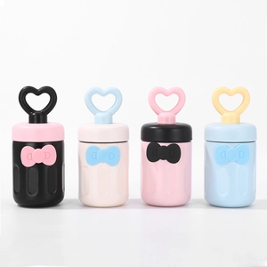 Detailed view of 316 stainless steel vacuum mugs with heart handles and bow relief decor