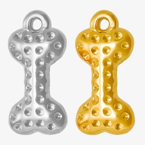 Detail showing gold and silver dog bone pendants with circular dotted texture for DIY jewelry