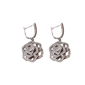 Elegant silver rose dangle earrings with hollow petals and pavé zircon accents