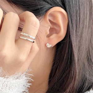 Minimalist 925 sterling silver bean stud earrings and ring set worn by model