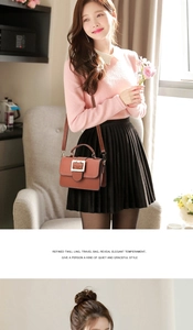 Brown vintage handbag with square metal buckle shown in an elegant indoor lifestyle setting
