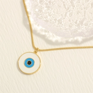 Detail of 18K gold-plated snake chain necklace with Turkish evil eye enamel pendant