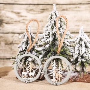3D wooden Christmas reindeer ornaments with natural jute rope on snowy pine background