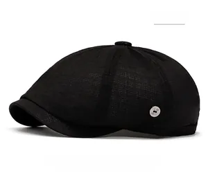 Close-up of black mesh beret showing breathable fabric texture and silver metal buckle detail