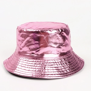 Detail of pink metallic patent leather bucket hat showing glossy texture and foldable design