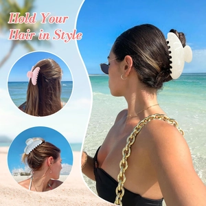 Elegant 11cm marble pattern hair claw clip for thick hair shown on model at beach