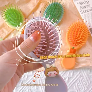 Cartoon air cushion massage hairbrushes in purple, orange, and green for hair styling