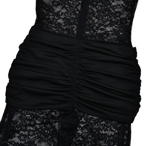 Close-up of black lace patchwork bodysuit featuring intricate ruffles and mesh texture