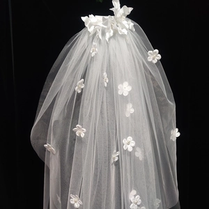 Elegant white bridal veil with 3D floral accents and pearls on layered soft tulle