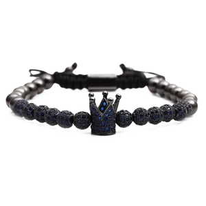 Macro shot of crown beaded bracelet with blue zircon and black metal beads