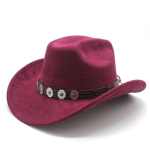 Detail of burgundy faux suede cowboy hat featuring a leather band with metal diamond studs