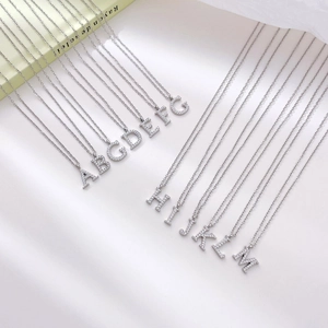 Minimalist silver initial necklace set with micro-pave cubic zirconia letter pendants