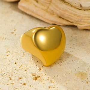 Detailed view of 18K gold plated heart ring with a high-polished mirror finish