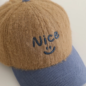 Plush brown faux fur kids baseball cap with blue corduroy brim and Nice smiley embroidery