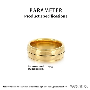 Macro detail of 8mm gold hammered texture stainless steel ring for men showing metallic finish