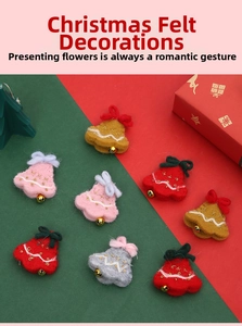 Detail of wool felt Christmas bell ornaments with ribbon bows and small gold bells