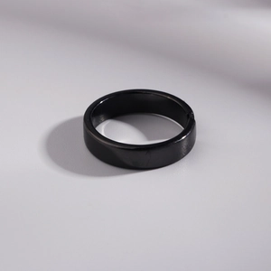 Minimalist black stainless steel open ring with a polished smooth finish for men