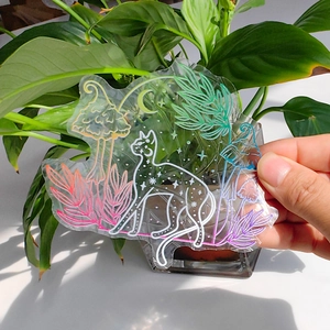 Close-up of static rainbow suncatcher sticker with moon cat and colorful mushroom patterns