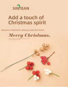 Detail view of shimmering gold, frosted red and white artificial Christmas berry stems