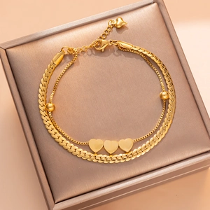 Double-layered gold titanium steel bracelet featuring heart charms and beads