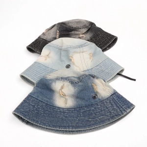 Vintage frayed denim bucket hats in three washed colors with metal button detail