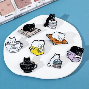 Detailed set of 8 cute cartoon cat enamel pins on white stone with blue background