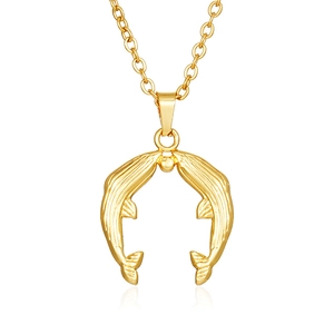 Detailed close-up of double dolphin pendant necklace in polished 18K gold finish