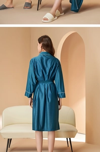 Detail of dark blue silk bathrobe with white piping and textured vertical stripes