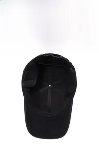 Detailed view of the warm fleece lining and ear flaps on a black winter baseball cap