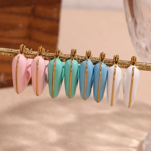 Polished 18K gold plated heart earrings with colorful enamel glaze hanging on a gold bar