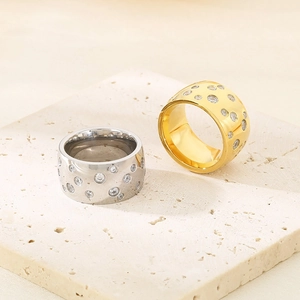 Wide titanium steel rings in gold and silver finish featuring star-set sparkling zircon