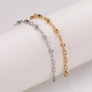 Polished stainless steel bracelet with engraved cylinder beads and oval links in gold and silver