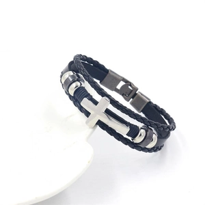 Detail of multi-layer braided black leather bracelet with silver metal cross and beads