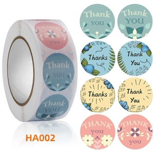 Close-up of floral Thank You stickers roll with four different botanical designs