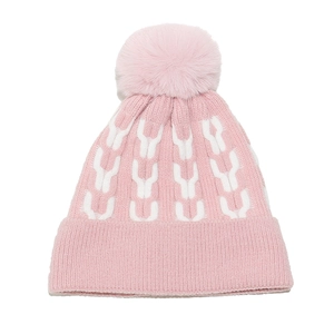 Pink and white knit beanie with geometric patterns, thick faux fur pom and ribbed cuff