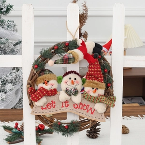 Christmas snowman rattan wreath with three plush dolls and Let It Snow festive banner