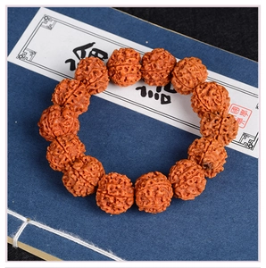 Macro detail of natural Rudraksha beads with deep textures on a vintage book background