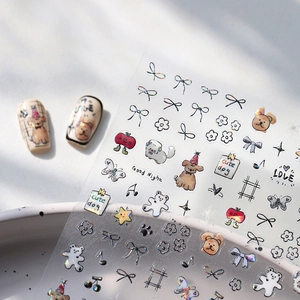 Cute puppy and floral nail art stickers with laser effect on white polka dot ceramic tray