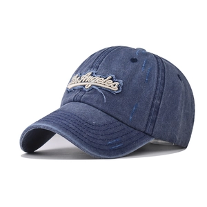 Washed navy blue Los Angeles embroidered baseball cap with distressed details and street style