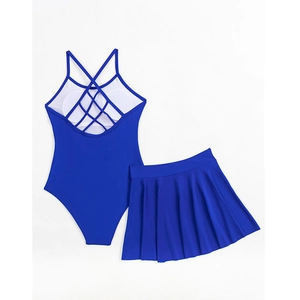 Detail of royal blue two-piece swimwear with cross-back straps and pleated skirt hem