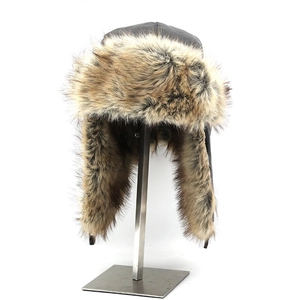 Close-up of winter leather Ushanka hat showing thick faux fur lining and ear flap details