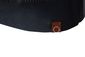 Macro view of dark grey ribbed knit hem with premium stitching and fashion label