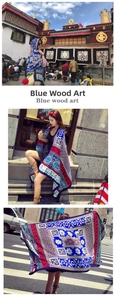 Detail of bohemian mandala print scarf with intricate patterns and fringe edges